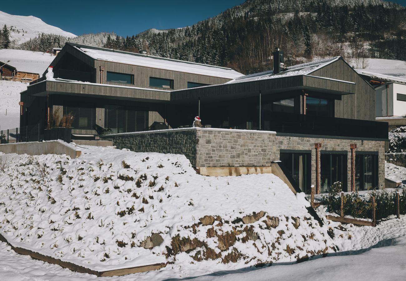 The building of our modern alpine-chic Apartment Alpinero 405 by We Rent in Piesendorf / Walchen