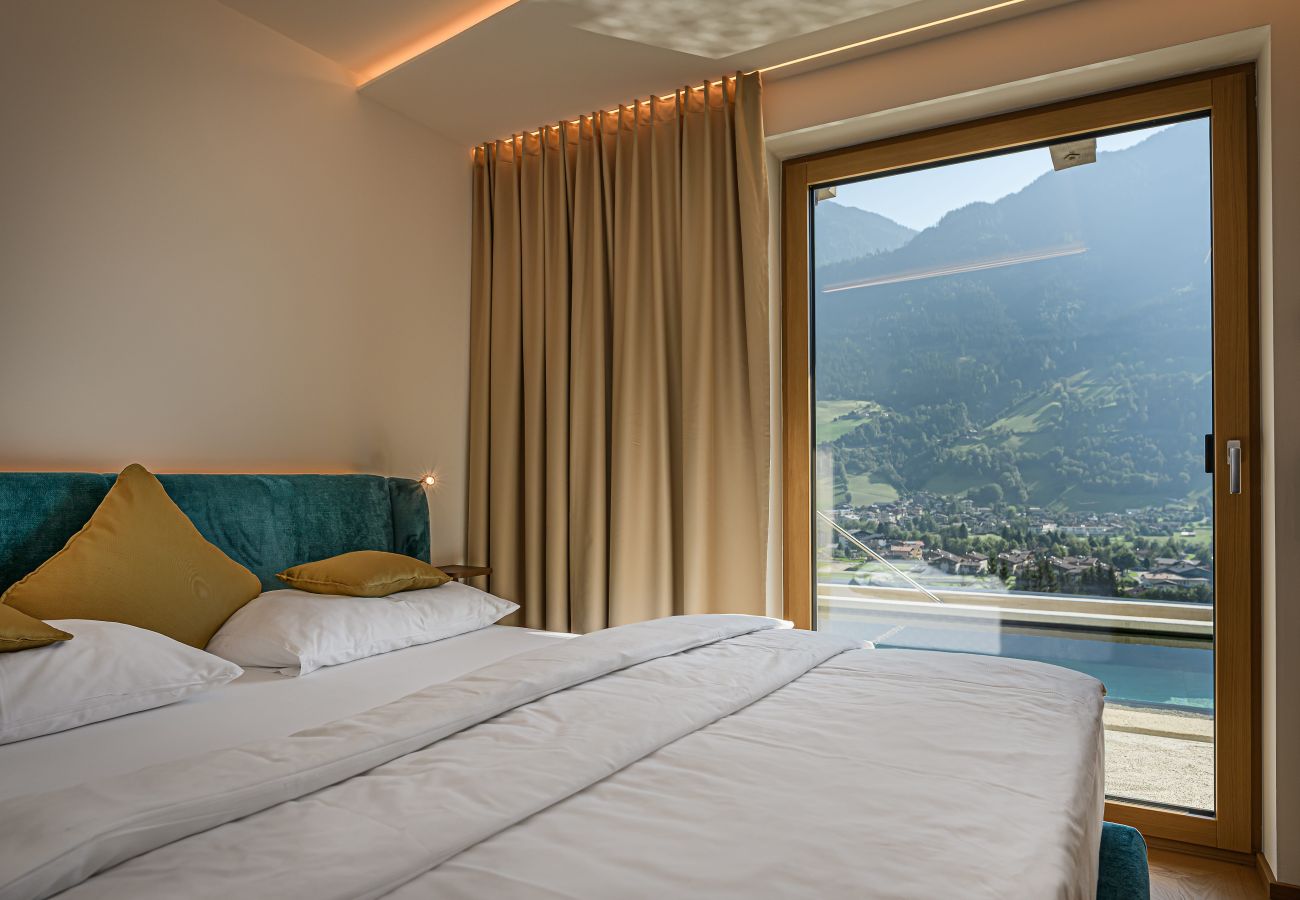 Bedroom with a double bed and modern bathroom in Design Apartments VIU by we rent